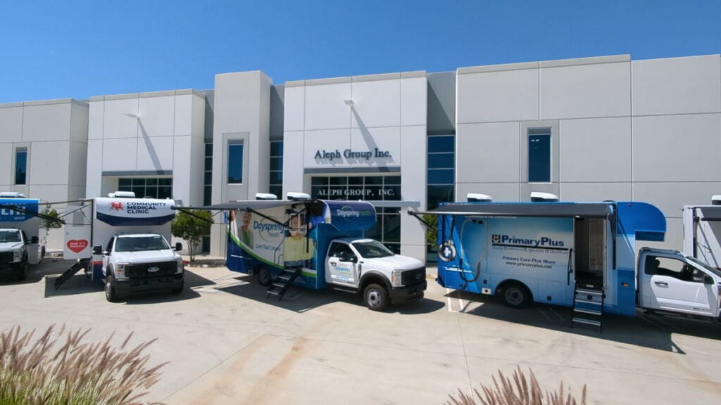 Kentucky Primary Care Association's 5 Mobile Health Units Parked in Front of the Aleph Group Inc. Manufacturing Building