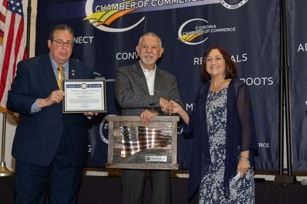 Jales receiving the Exporter of the Year Award on stage at the Inland Empire World Trade Conference presentation.
